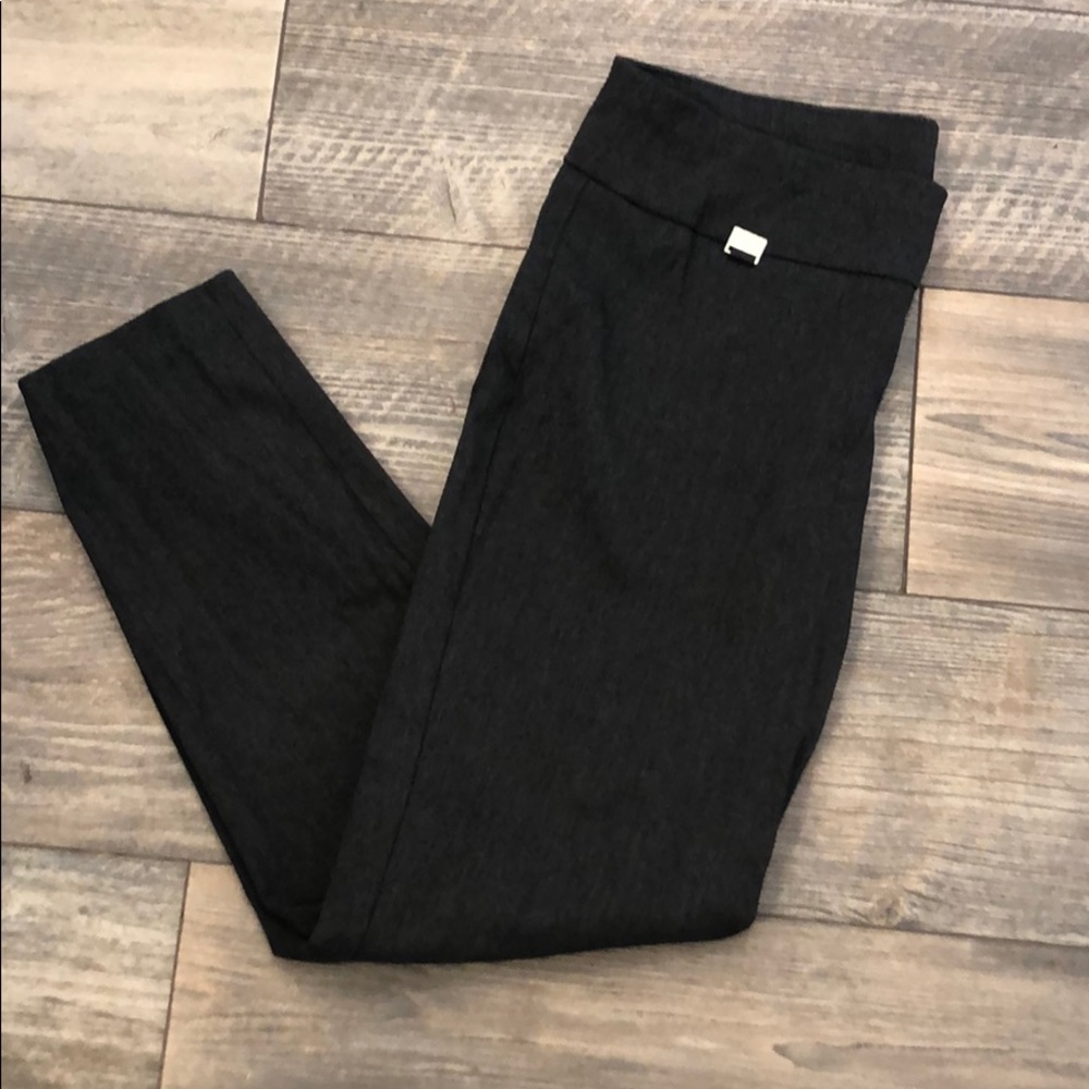 Dark gray colored tummy-control trouser pants.